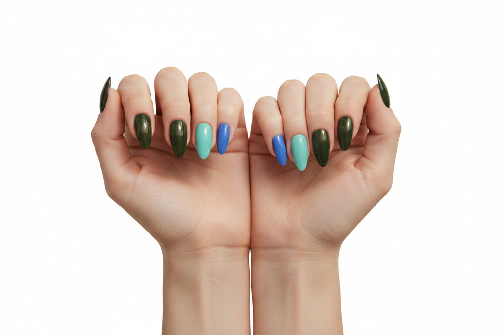 A clean product close-up of the Essentials Press-On Kit New Moon and Mint Sky Bundle by Bloom Gloss Co, showcasing fifteen glossy almond fake nails arranged in rows of deep moss green, light mint green, and cosmic purple-blue.