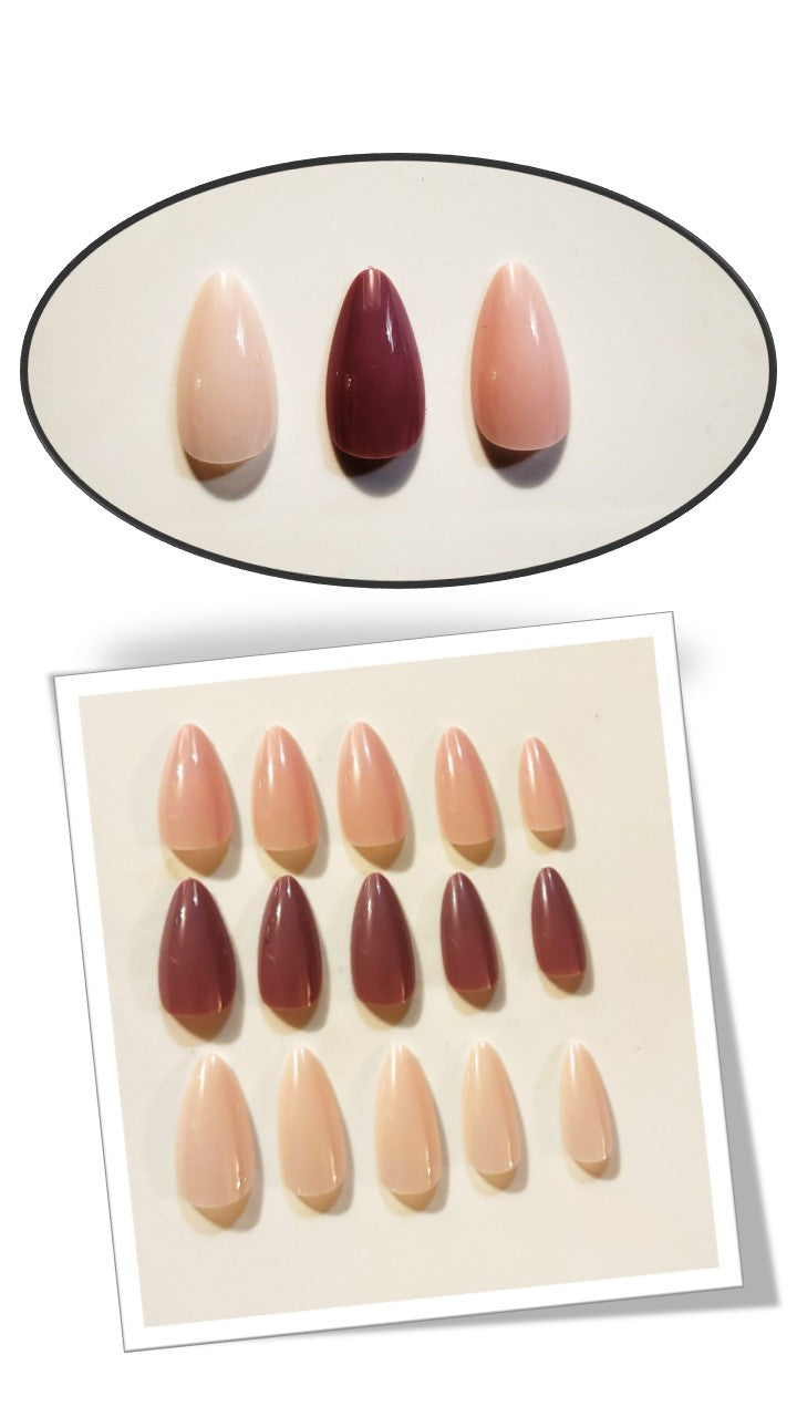 The Essentials Press-On Kit Sweet Plum and Nude Blush Bundle by Bloom Gloss Co: a multi-color 72-count set of glossy almond fake nails displayed in a framed and circled design against a cream background.