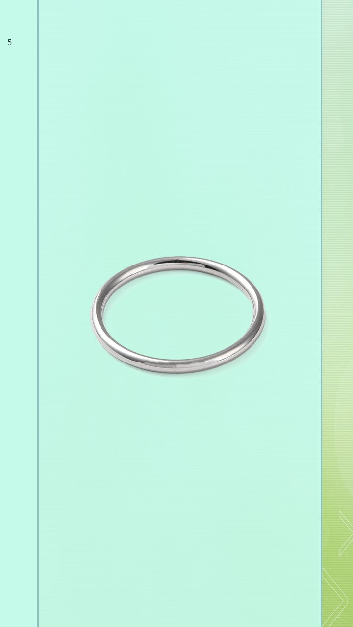 Shop the Classic Hoop Ring at Bloom Gloss Co. This delicate minimalist round silver stacking band features a sleek mirror finish, perfect for daily layering.