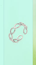 Shop the Infinity Loop Ring at Bloom Gloss Co. This non-tarnish stainless steel adjustable oval chain band delivers water-resistant style for everyday wear.