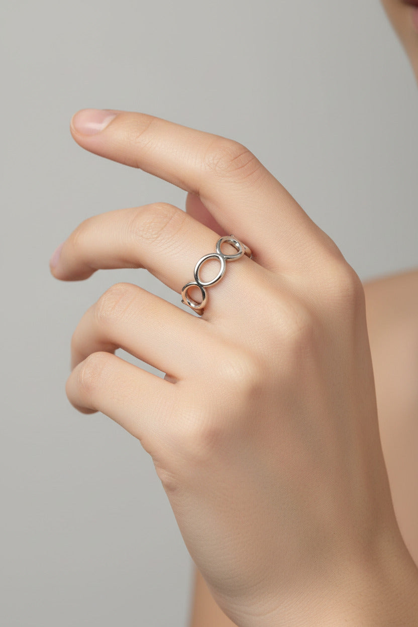 Shop the Infinity Loop Ring at Bloom Gloss Co. This non-tarnish stainless steel adjustable oval chain band delivers water-resistant style for everyday wear.