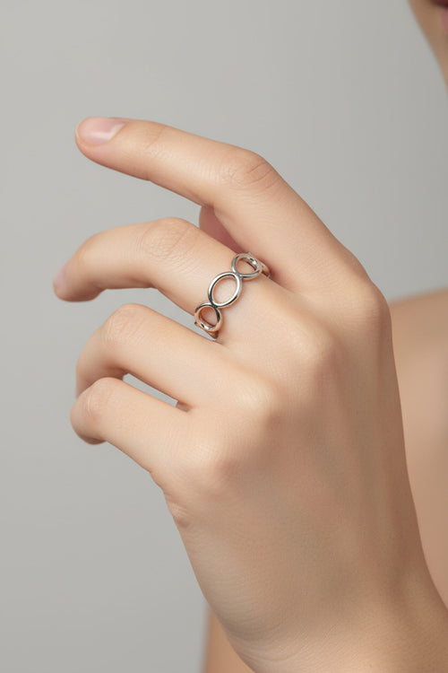 Shop the Infinity Loop Ring at Bloom Gloss Co. This non-tarnish stainless steel adjustable oval chain band delivers water-resistant style for everyday wear.