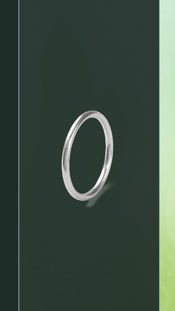 Shop the Classic Hoop Ring at Bloom Gloss Co. This delicate minimalist round silver stacking band features a sleek mirror finish, perfect for daily layering.