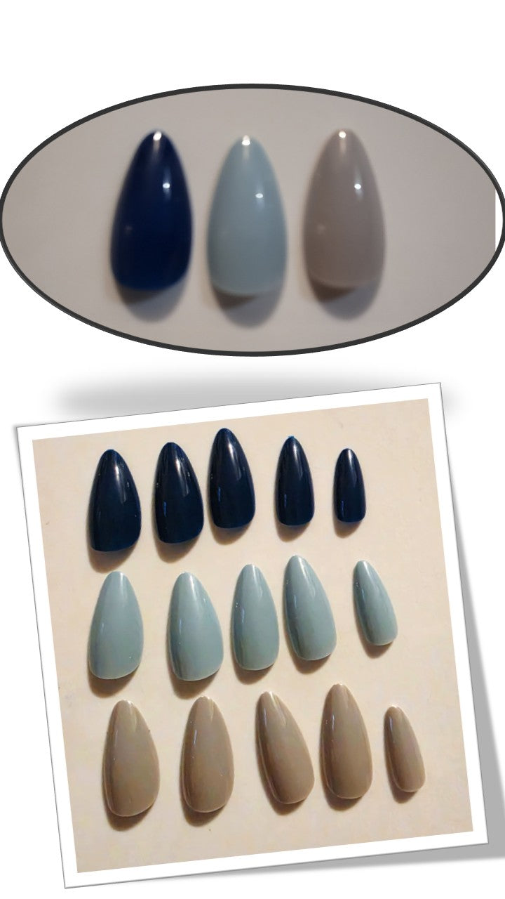 The Essentials Press-On Kit Blueberry Storm Bundle by Bloom Gloss Co: a 72-count set of medium almond fake nails showcasing three glossy colors in navy blue, sage mist, and taupe nude.