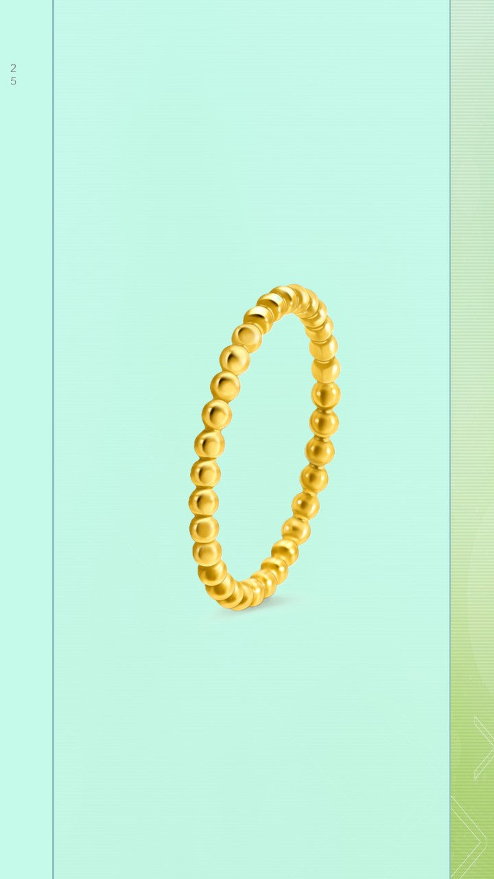 Elegant gold-plated thin stacking band with a textured, continuous halo pearl bubble design, shown close up to highlight the polished finish.