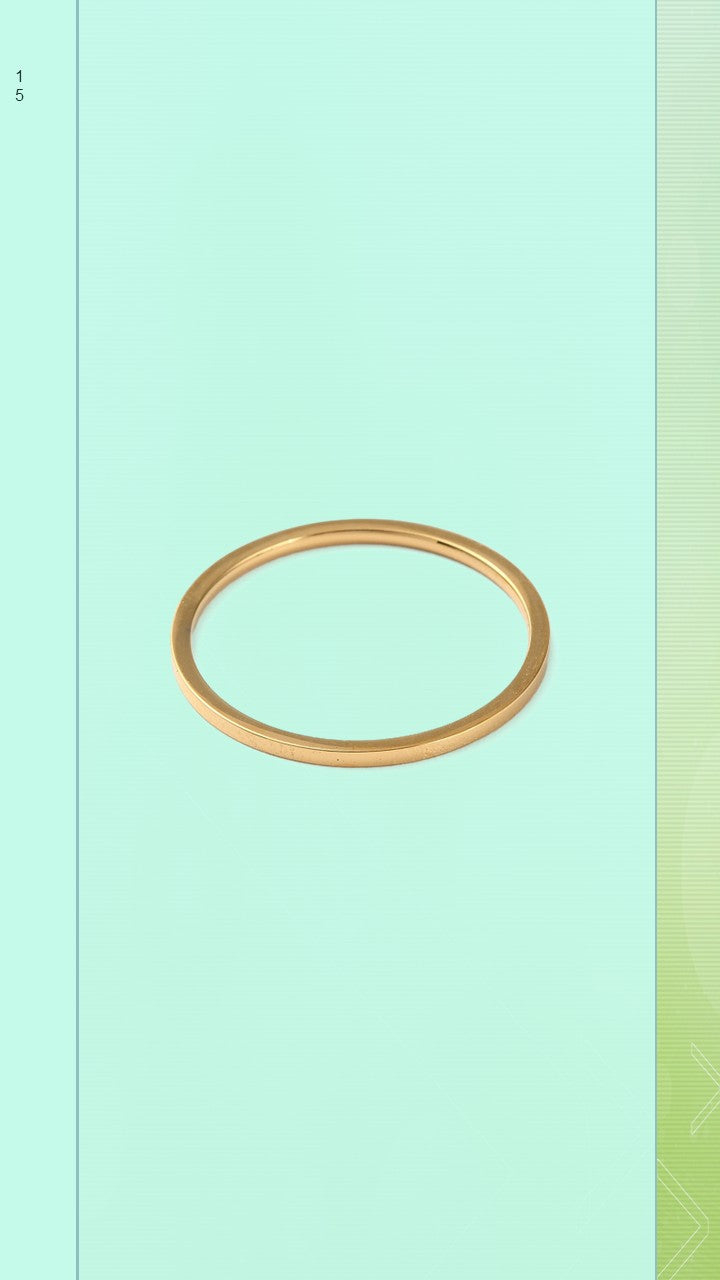 The Pure Band by Bloom Gloss Co: a flat-lay view of a minimalist 1mm 18K gold plated ring showcasing its polished square profile and clean edges, isolated on a light mint green background.