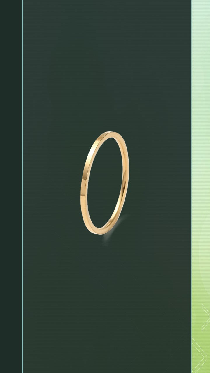 The Pure Band by Bloom Gloss Co: a dainty 1mm 18K gold plated ring showing a high-shine polished square profile with clean edges against a dark olive background.