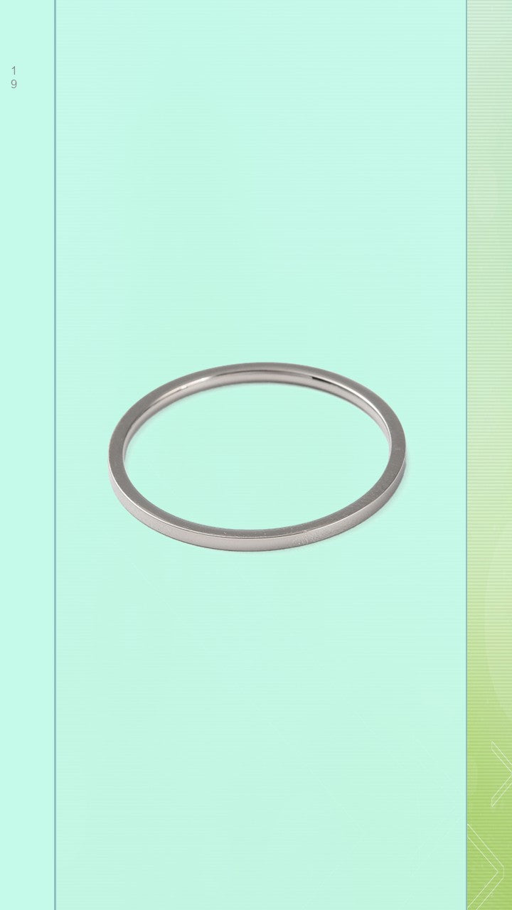 The Pure Band by Bloom Gloss Co: a dainty 1mm sterling silver ring showing a high-shine polished square profile with clean edges against a dark olive background.