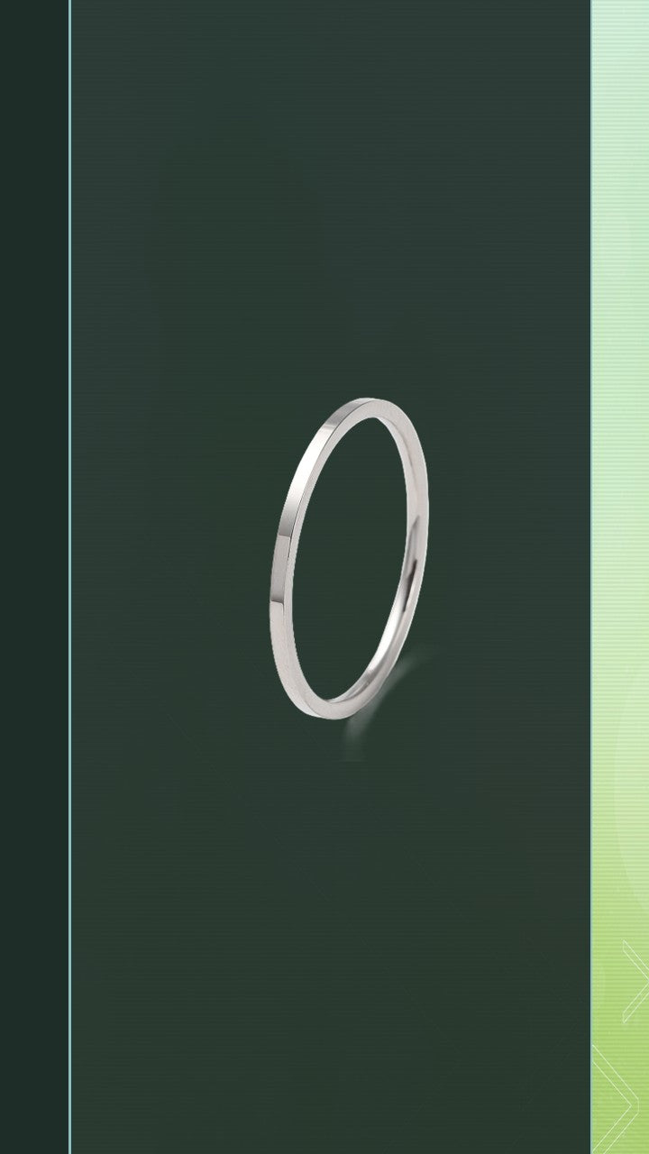 The Pure Band by Bloom Gloss Co: a dainty 1mm sterling silver ring showing a high-shine polished square profile with clean edges against a dark olive background.